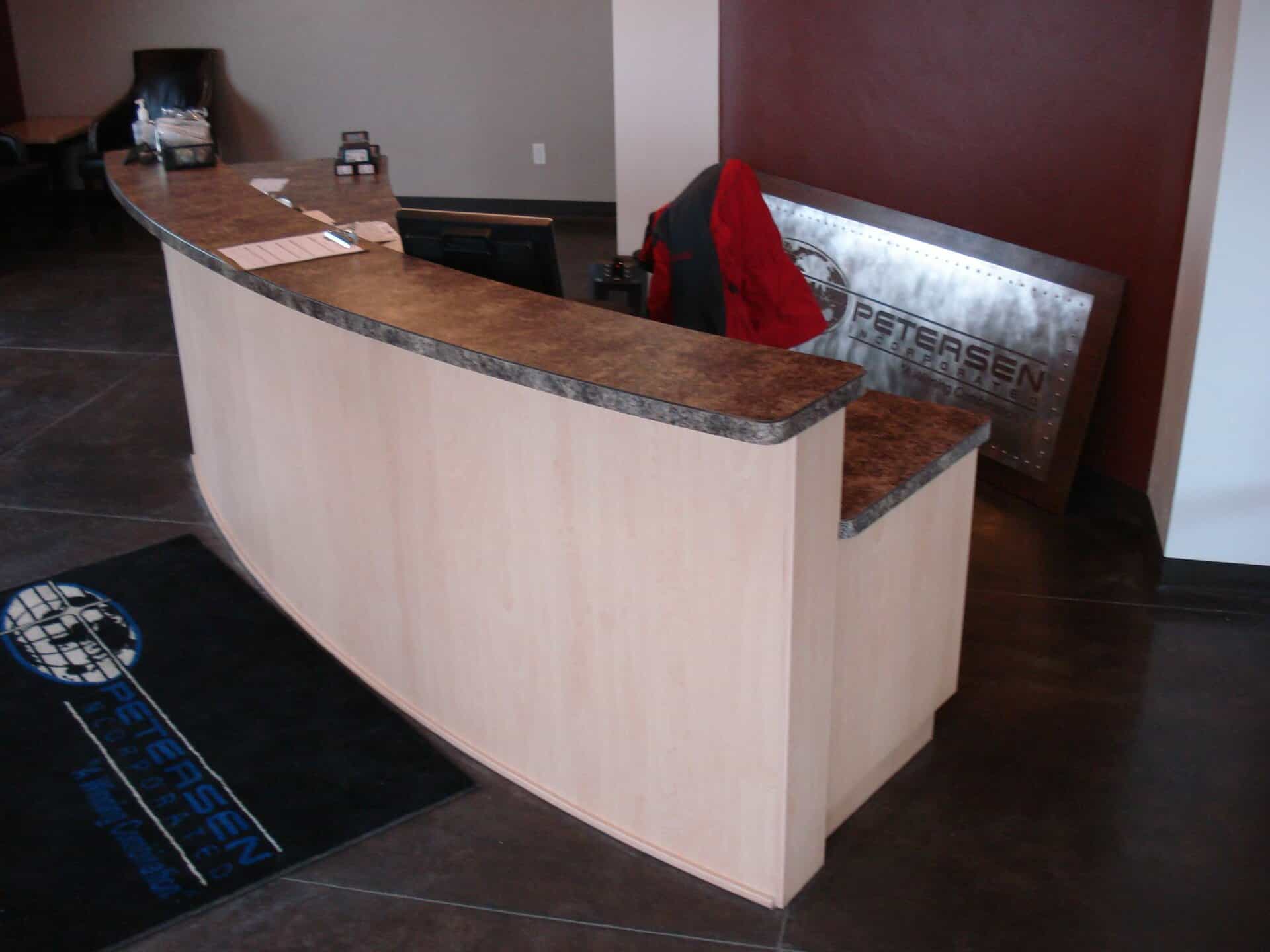 Laminate countertop on light wooden desk at Peterson Inc.