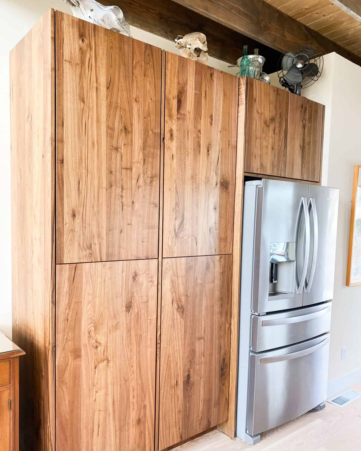wooden cabinets around fridge