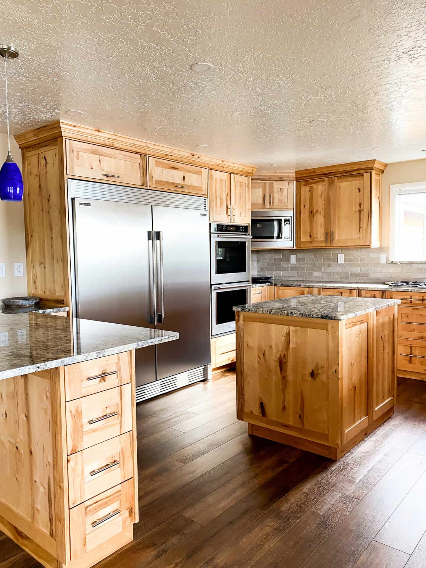 kitchen with all brown wooden cabinets