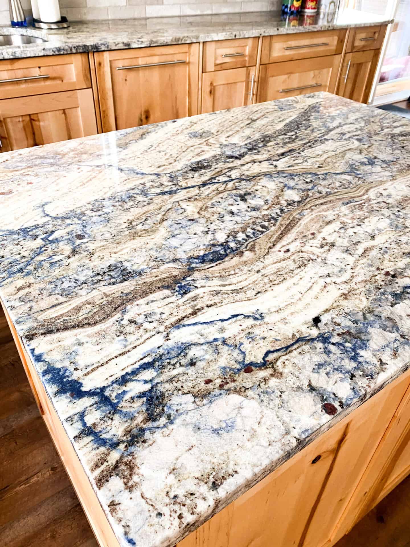 marble counter and wooden cabinets