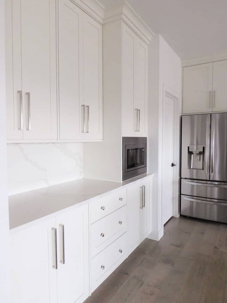 another angle of white kitchen cabinets from Millennial Cabinetry and Millwork