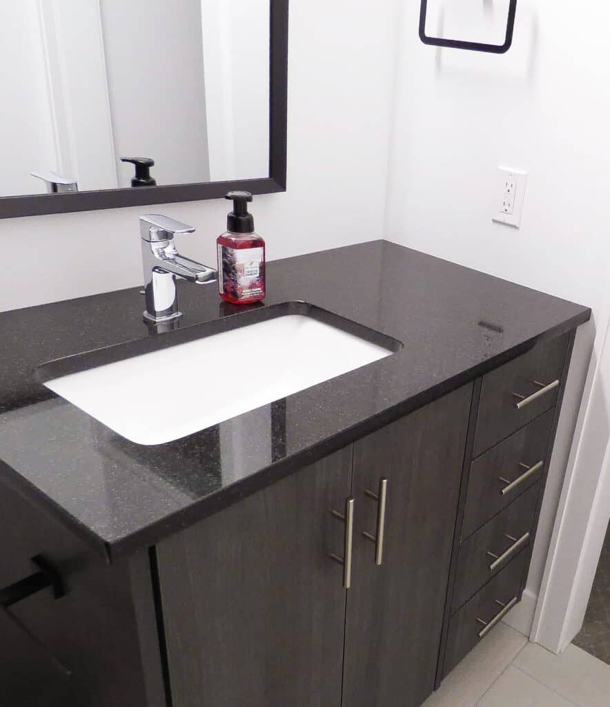 single dark vanity from Millennial Cabinetry and Millwork