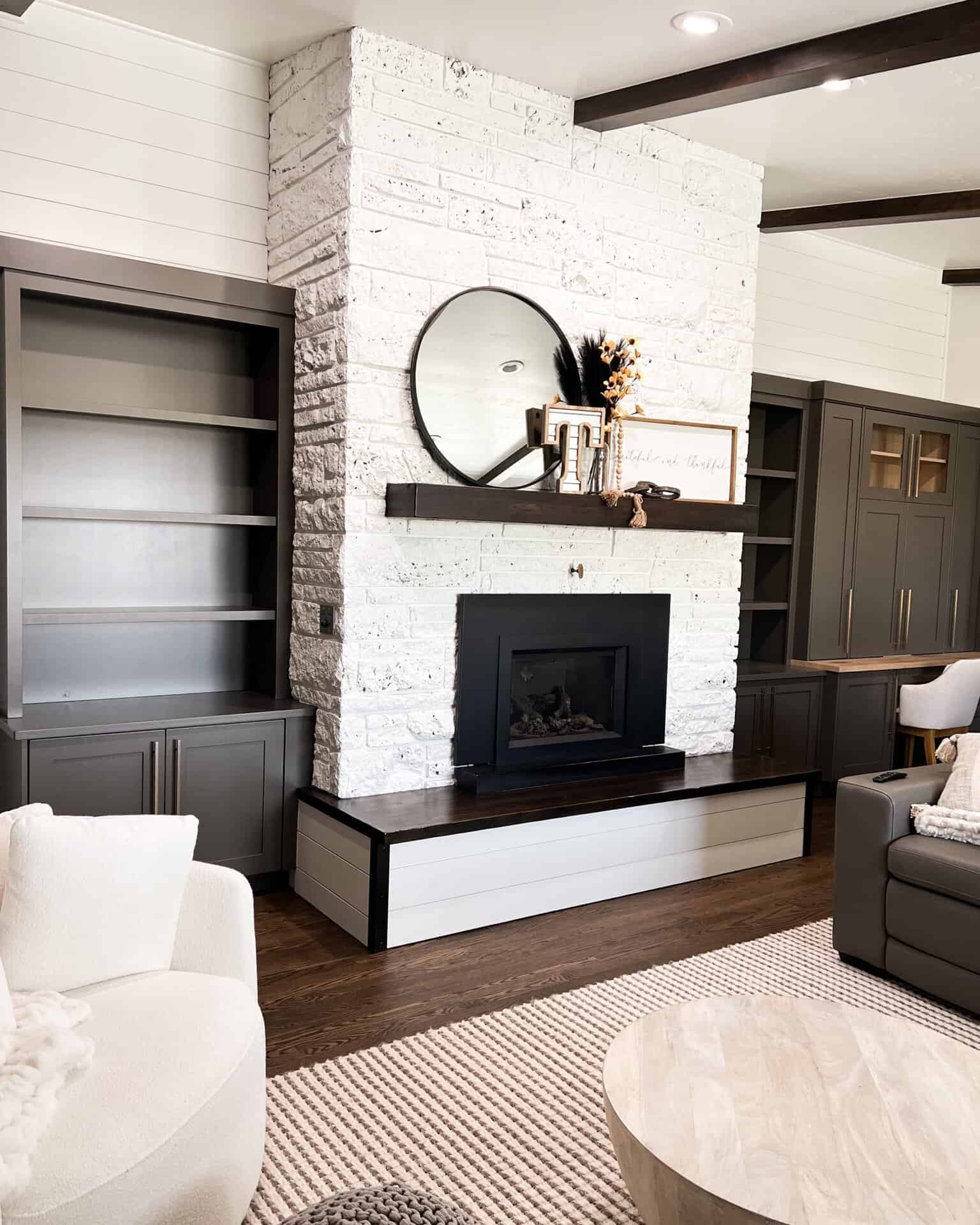 fireplace with custom built ins on either side